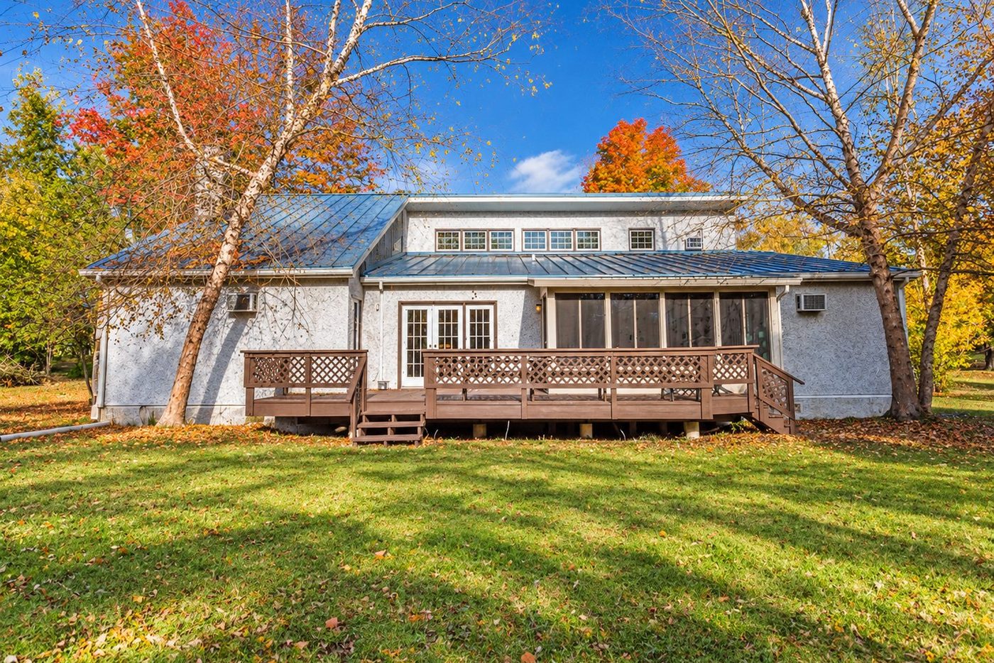 Men's house, Hatfield, PA — back of the house with its deck and autumn trees